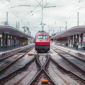 Red railway vehicle on the platform